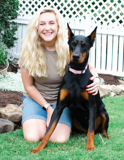 cameo-huggins-miss-kittys-dog-resort-co-manager-with-dog-iris